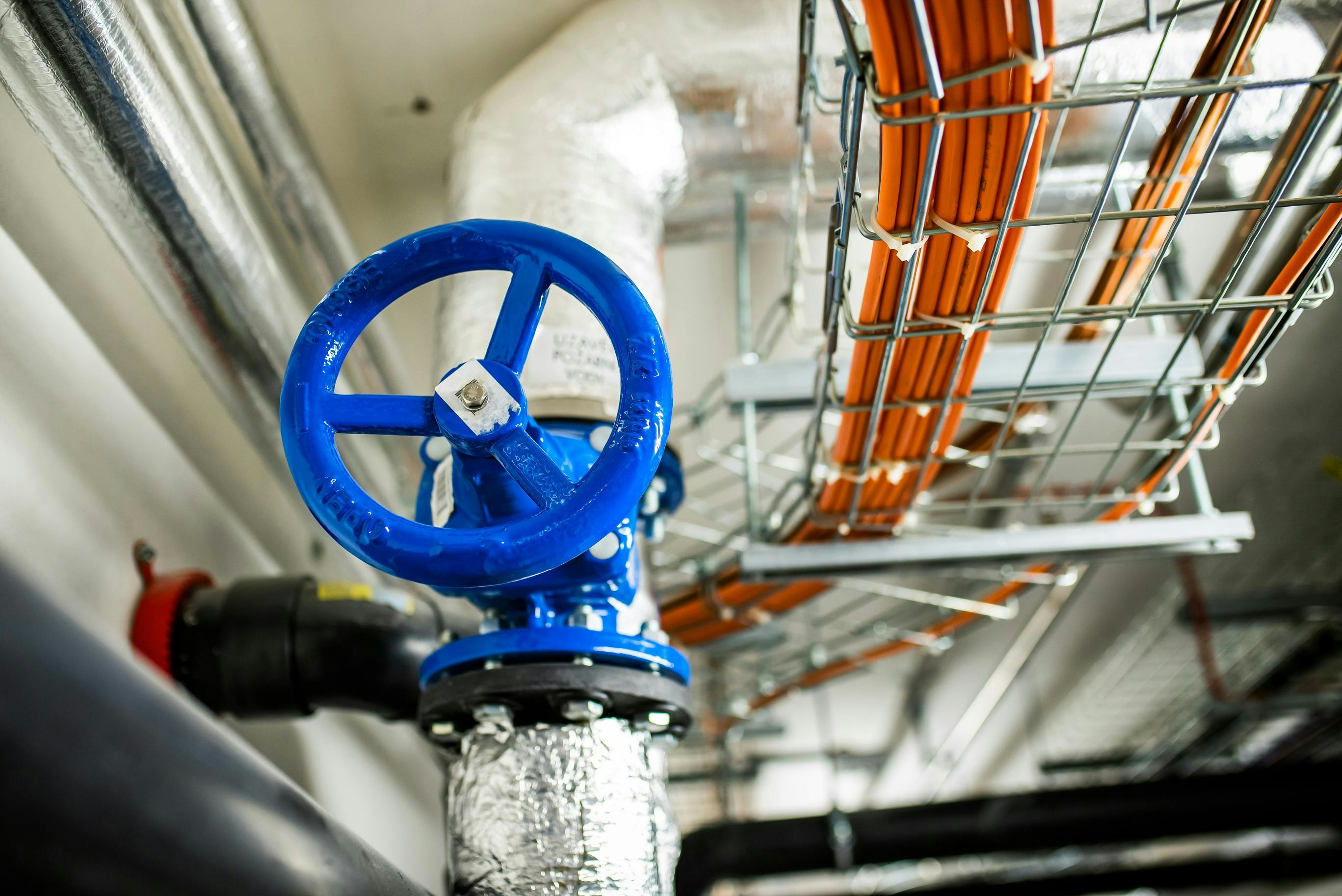 Water shutoff valve near industrial networking cables