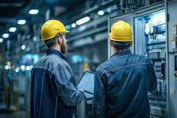 workers inspect control cabinet and its industrial network communications workers inspect control cabinet and its industrial network communications