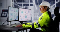 industrial engineer reviewing SCADA screen industrial engineer reviewing SCADA screen